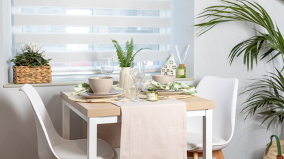 Neutral dining table with two chairs