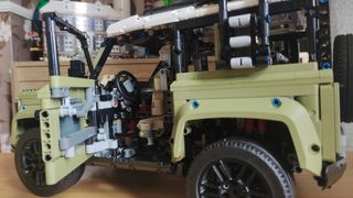 Lego Technic Land Rover Defender 42110 - angled side view of car, door open.