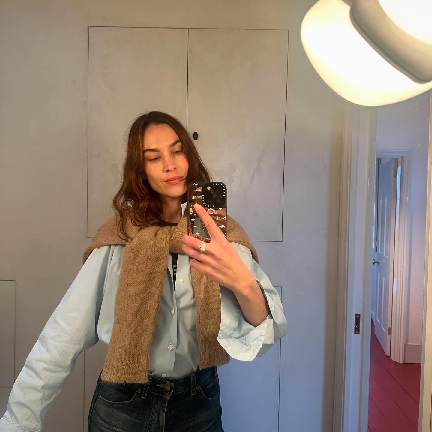 An image of Alexa Chung wearing a classic button down, one of the biggest shirt trends for 2025.