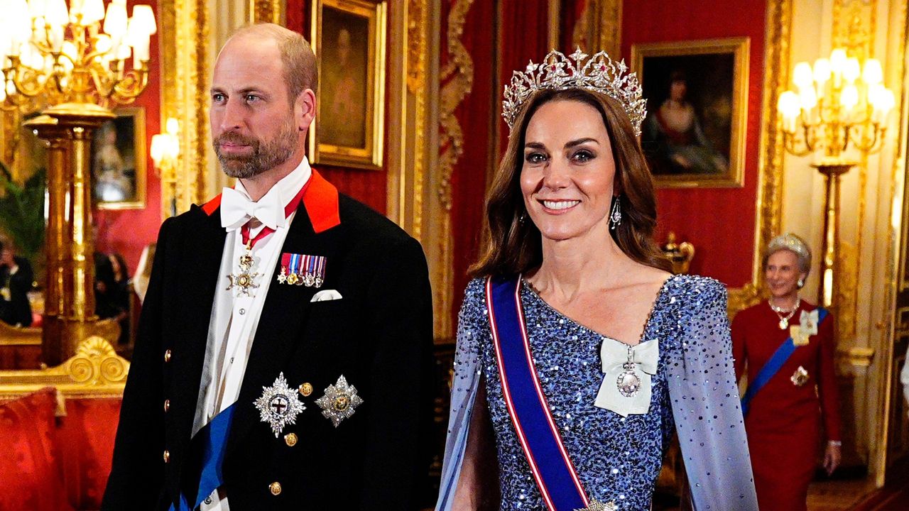 The Prince and Princess of Wales smile and walk ahead of the state banquet for the German President Frank-Walter Steinmeier and his wife, at Windsor Castle