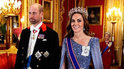 The Prince and Princess of Wales smile and walk ahead of the state banquet for the German President Frank-Walter Steinmeier and his wife, at Windsor Castle