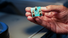 The low-power microchip in a person's hand.