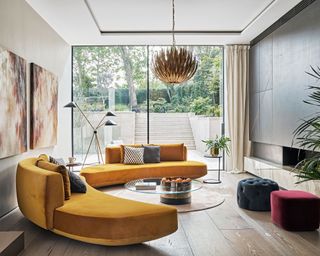 Modern living room with curved sofa and wood floor