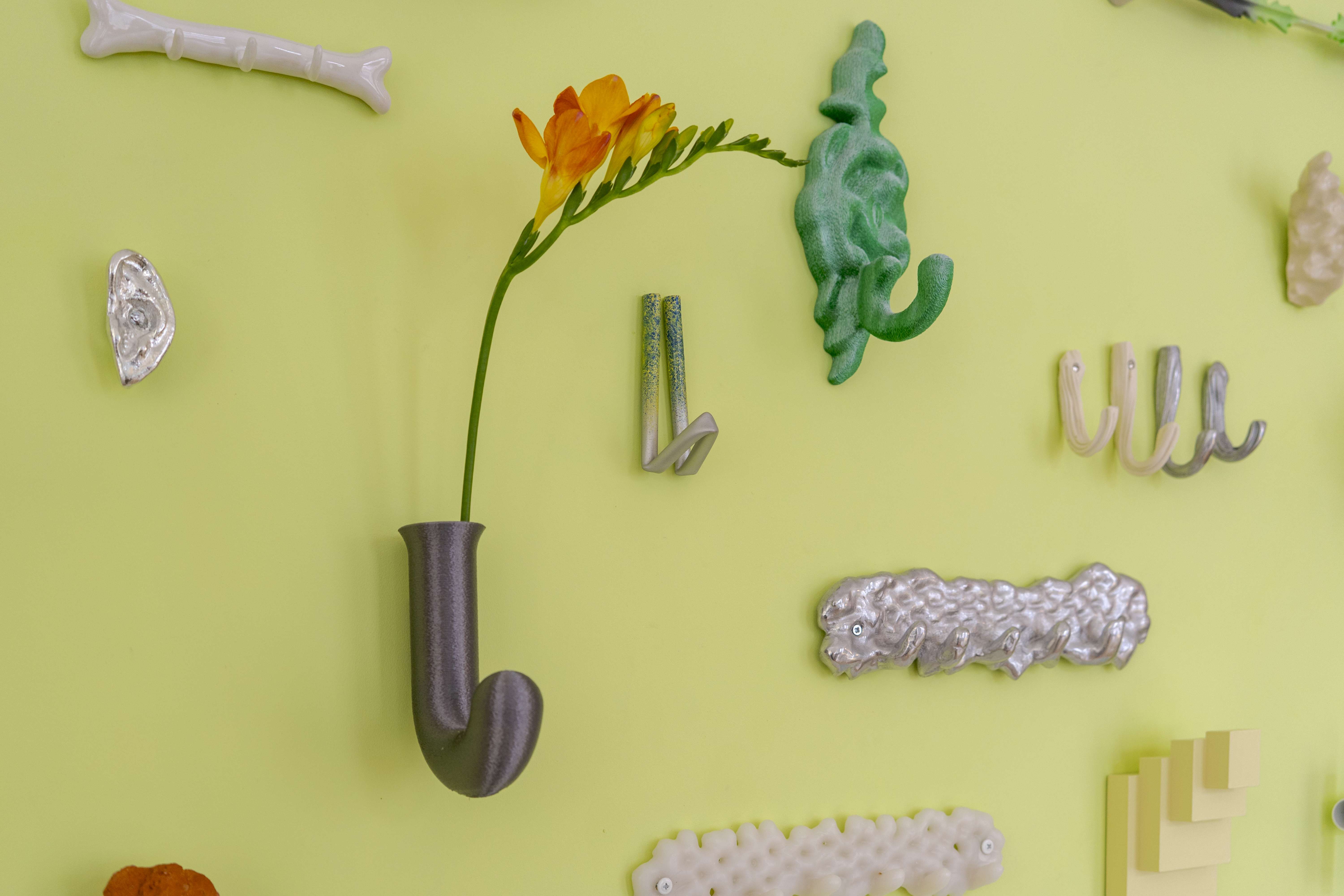 Works on show included a tin ear hook by Kajsa Willner, a hook-vase by Gustave Carlberg and a green 3D-printed hook by Sofie Håwi. Photograph by Ebba Lindgren (1)