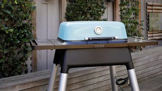 Everdure gas grill in a backyard