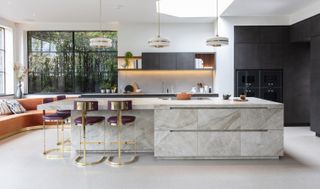 a marble kitchen island with seating