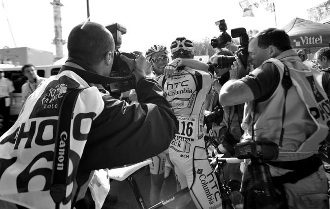 Tour de France 2010: Team HTC-Columbia's Mark Cavendish celebrates after winning stage 18 and is pounced upon by the media