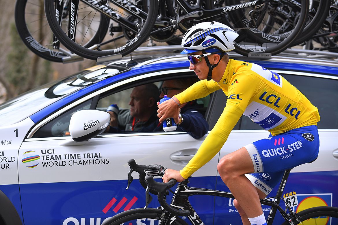 Race leader Julian Alaphilippe takes a drink from the team car in the fifth stage of Paris-Nice.