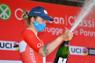 DE PANNE BELGIUM MARCH 25 Podium Emma Norsgaard Jorgensen of Denmark and Movistar Team 2nd place Celebration during the 4th Oxyclean Brugge De Panne 2021 Women Classic a 1588km race from Brugge to De Panne Champagne OxycleanClassic UCIWWT on March 25 2021 in De Panne Belgium Photo by Luc ClaessenGetty Images