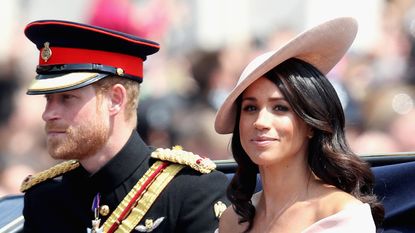 LONDON, ENGLAND - JUNE 09: Meghan, Duchess of Sussex and Prince Harry, Duke of Sussex during Trooping The Colour on the Mall on June 9, 2018 in London, England. The annual ceremony involving over 1400 guardsmen and cavalry, is believed to have first been performed during the reign of King Charles II. The parade marks the official birthday of the Sovereign, even though the Queen's actual birthday is on April 21st. . (Photo by Chris Jackson/Getty Images)