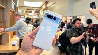 Google Pixel 7 Pro hands on back angled Snow