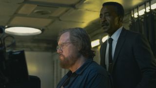 Steve Agee and Tim Meadows' Peacemakers looking at a computer monitor