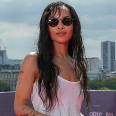 Zo&euml; Kravitz joined Harry Styles in NYC wearing dark indigo jeans and a The Row leather bag