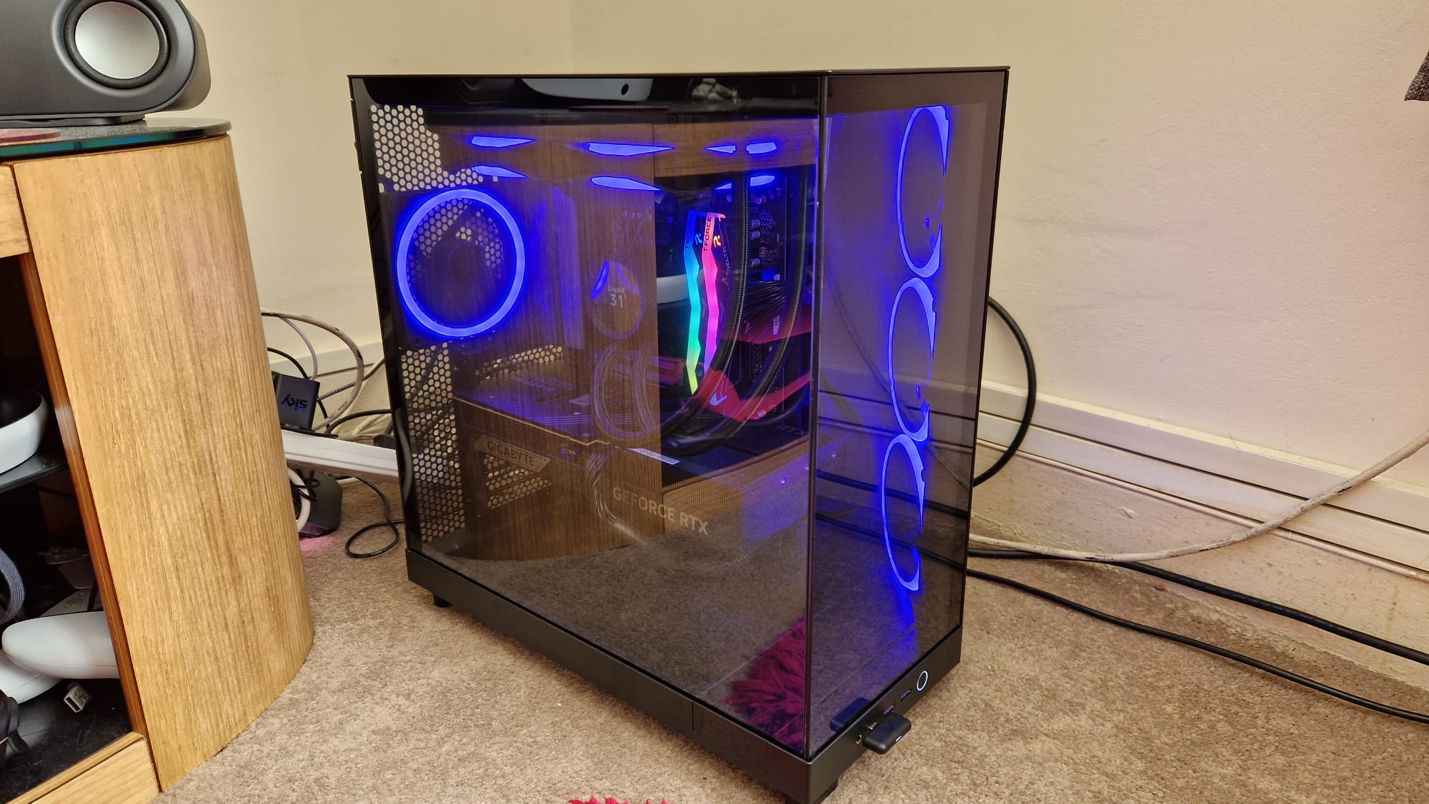 The NZXT Player Three RTX 5080 Edition with blue lighting