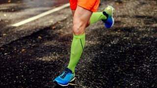 Runner wearing knee-high compression socks