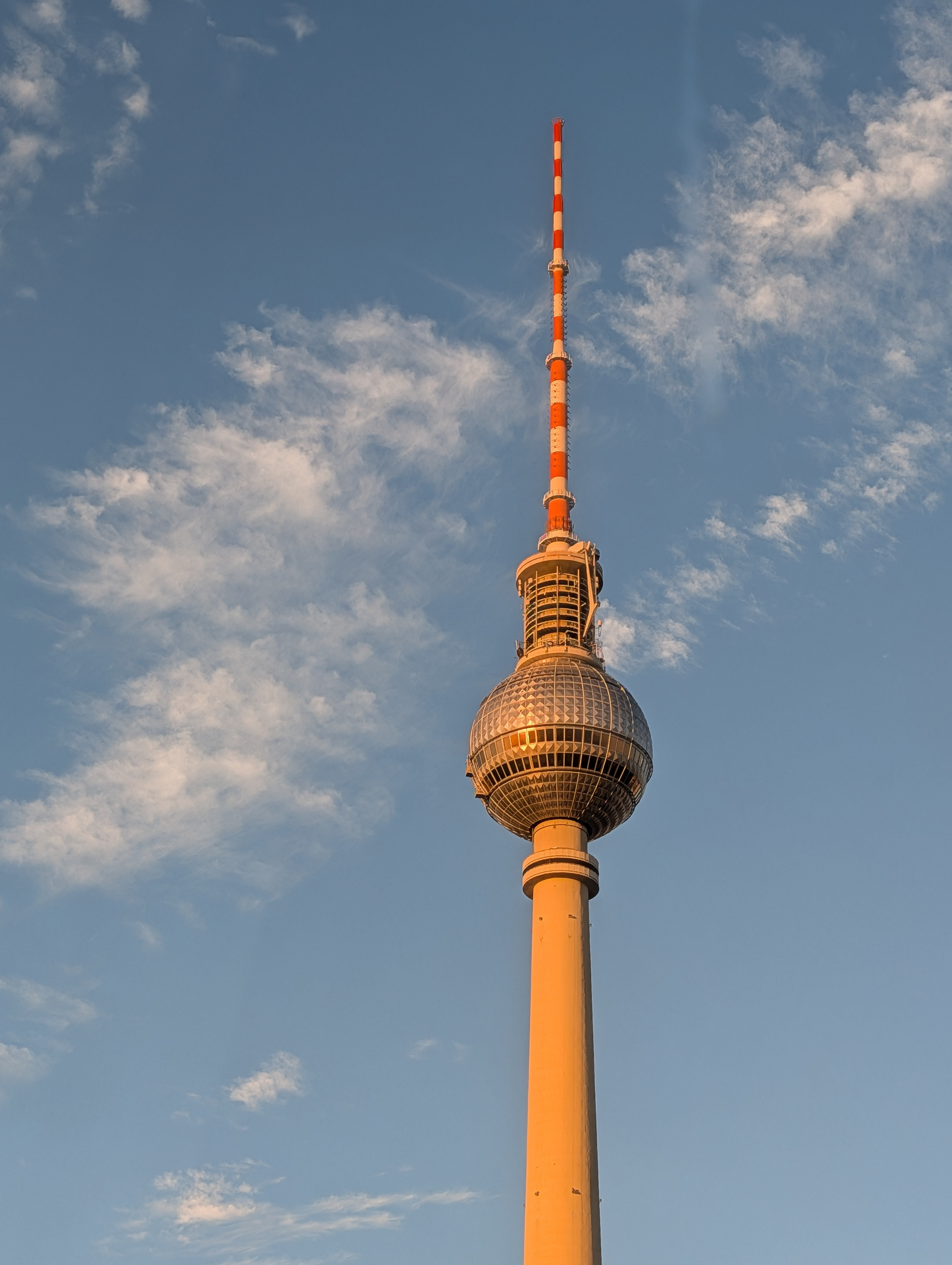 The TV tower in Berlin lit in the sunrise