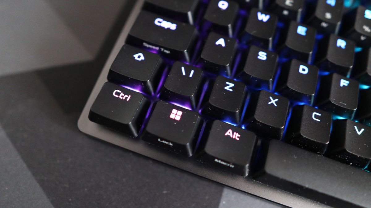 The Asus ROG Falchion Ace 75 HE on a desk with the lighting enabled.