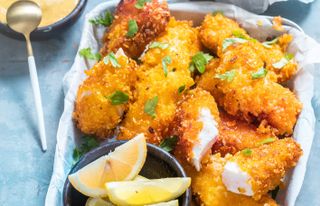 Homemade fish fingers golden covered in crisp crumb