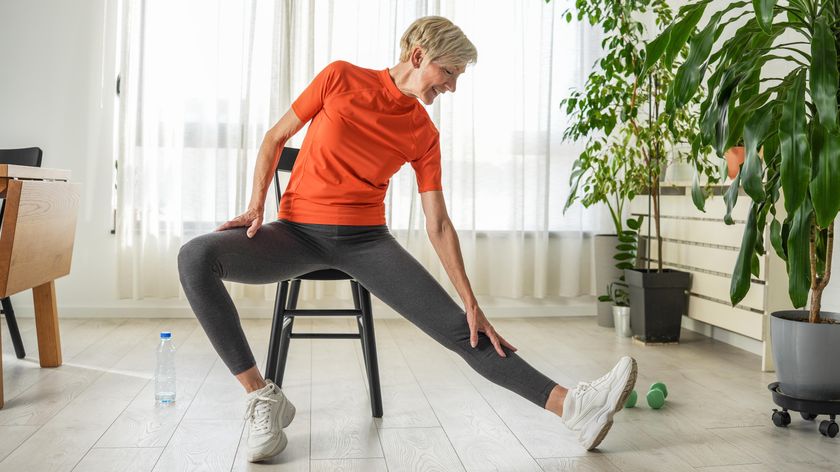 a senior woman doing a chair workout