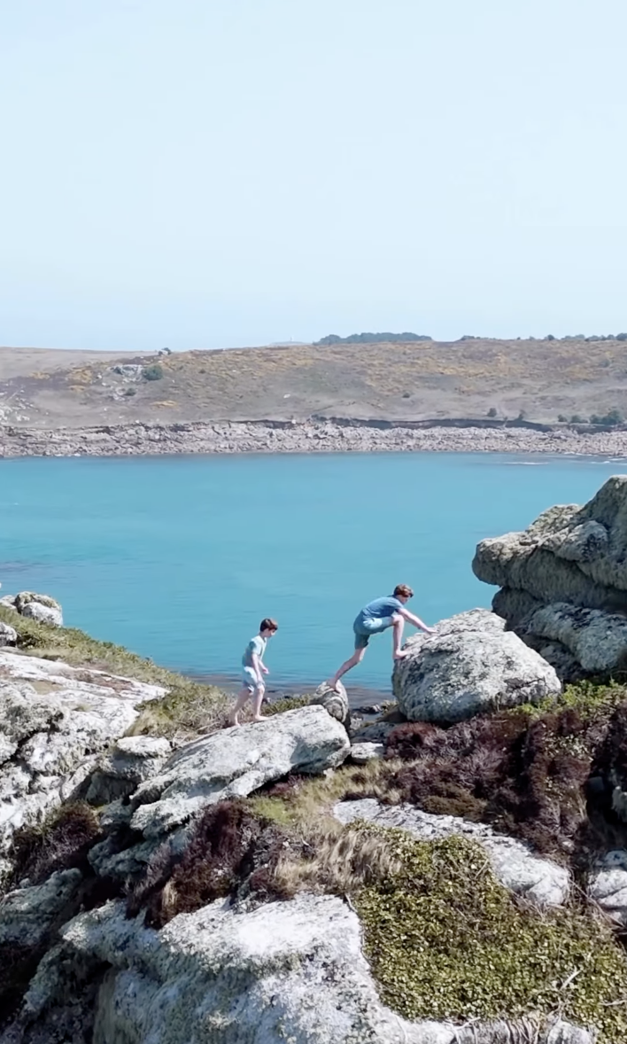 Prince George and Prince Louis climbing rocks