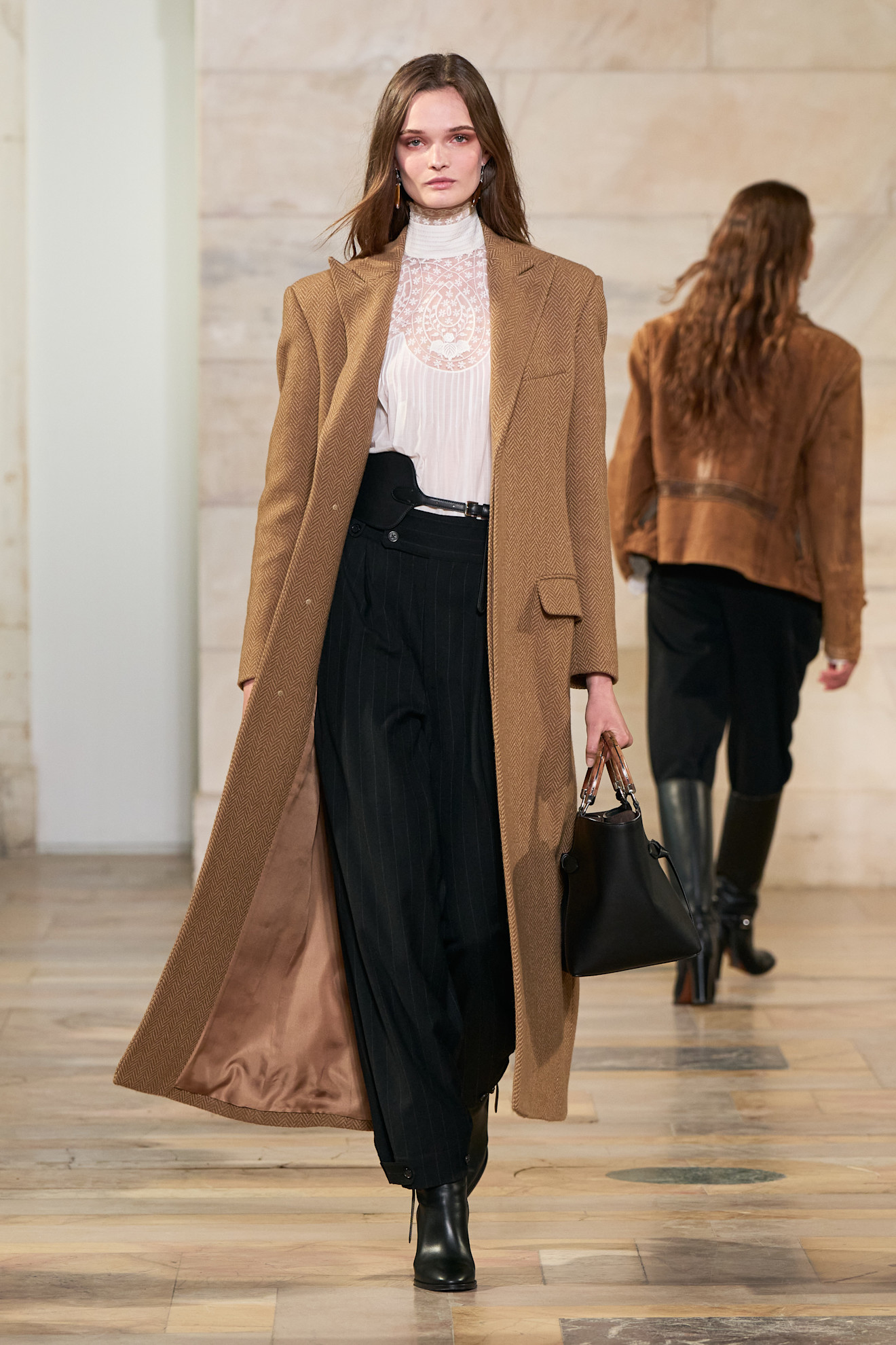 An image of a camel coat on the Ralph Lauren autumn/winter 2025 runway.