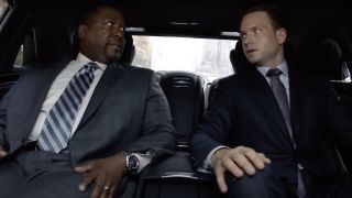 Wendell Pierece and Patrick J. Adams sitting in car in Suits