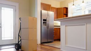 How to find the best refrigerator online: Image show refrigerator in kitchen and delivery cart