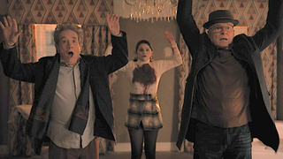Charles, Mabel and Oliver stand with their hands up over Bunny's dead body in Only Murders in the Building.