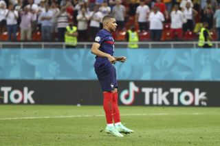 Kylian Mbappe reacts after missing France’s crucial fifth penalty against Switzerland