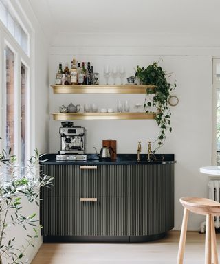 At home coffee bar station in corner with gold styled floating shelves