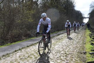 Fabian Cancellara rides through the Arenberg forest secteur