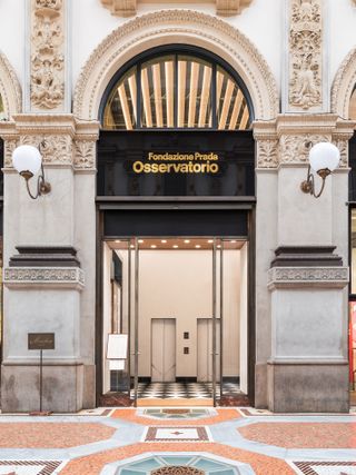 The swanky facade of an art gallery in an historical arcade.