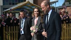 Prince William, Prince of Wales and Catherine, Princess of Wales walk with with Junior School Head Adrian Antell during a visit to Farnborough Road Infant and Junior School on September 23, 2025