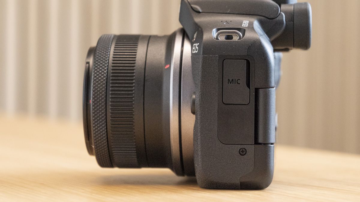Side of Canon EOS R50 on a table with mic port
