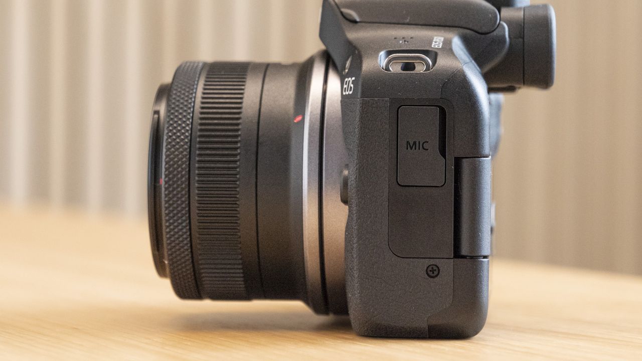 Side of Canon EOS R50 on a table with mic port