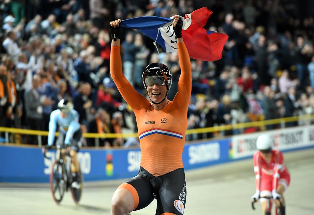 Netherland's Kirsten Wild celebrates after her victory in the women's scratch race at The UCI World Cycling Championships in Apeldoorn