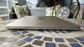 At home with 15-inch MacBook Air, on a mosaic balcony table and on a wooden floor.