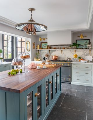 green kitchen with marble backsplash by Liz Caan & Co