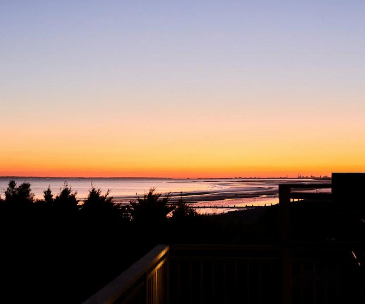A view of a beach from a balcony at night