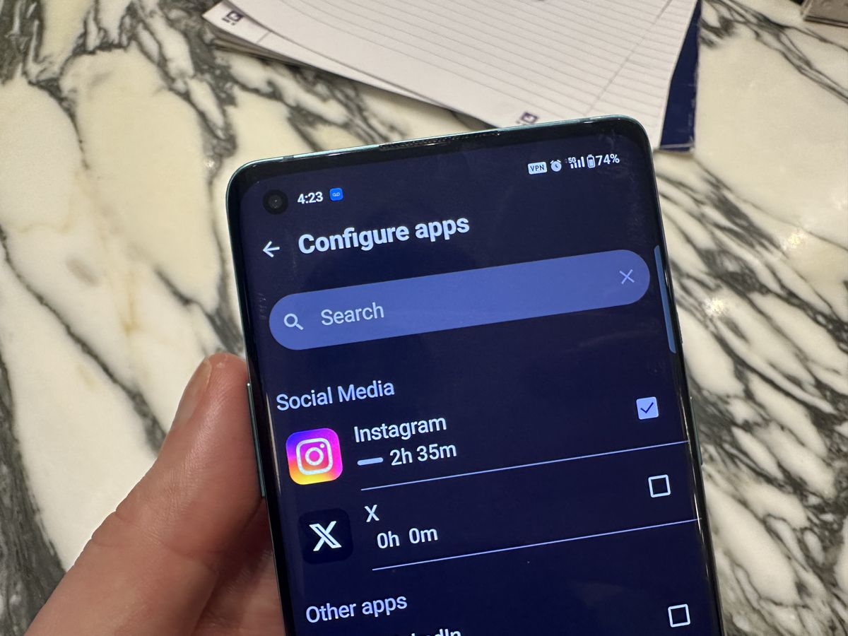 One Sec app, open on Android smartphone against marble table.