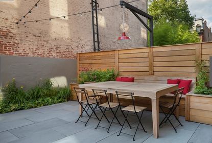 A painted backyard wall in a mushroom brown grey