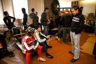 Viacheslav Ekimov chats with Daryl Impey and Chris Horner, while Gert Steegmans (left) checks conditions outside.