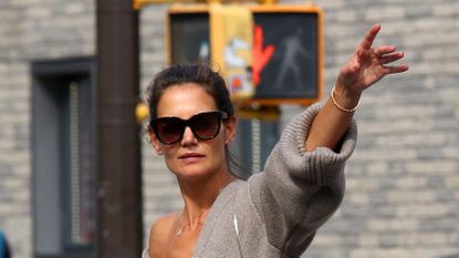 Katie Holmes shows major cleavage while hailing cab with Suri Cruise in NYC