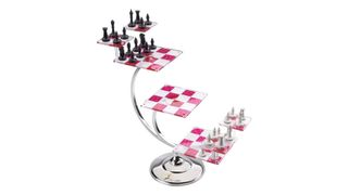 A pink and white chess board with five platforms and six boards on a silver stand infront of a white background.