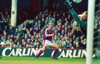 West Ham United player Paolo Di Canio fires in the first goal past Neil Sullivan during the FA Carling Premiership match between West Ham United and Wimbledon at Upton Park on March 26, 2000 in London, England, West Ham won the game 2-1 and Di Canio's goal was voted goal of the season.
