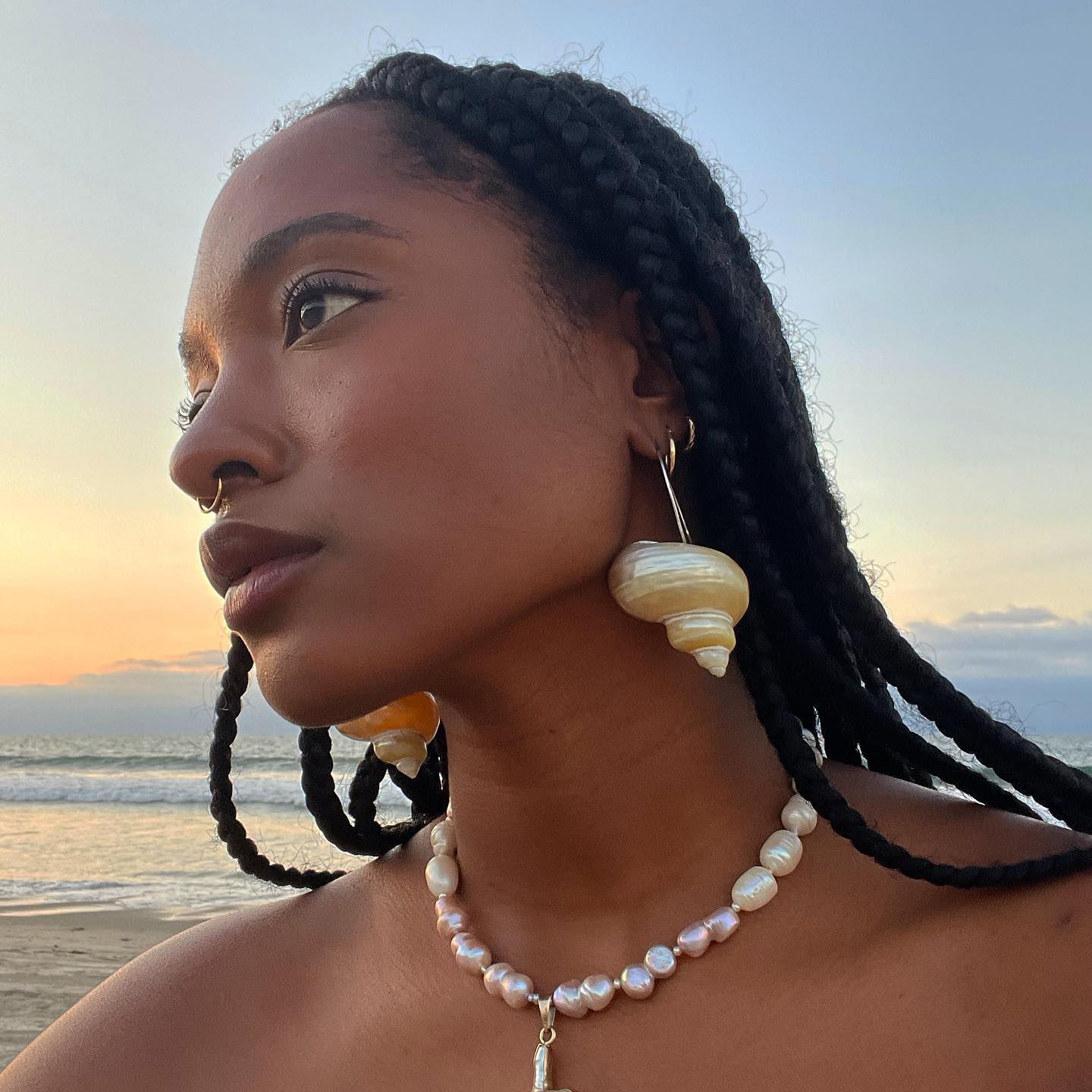 Gabriella with glowing skin and medium knotless braids