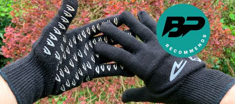 Black cycling gloves on hands