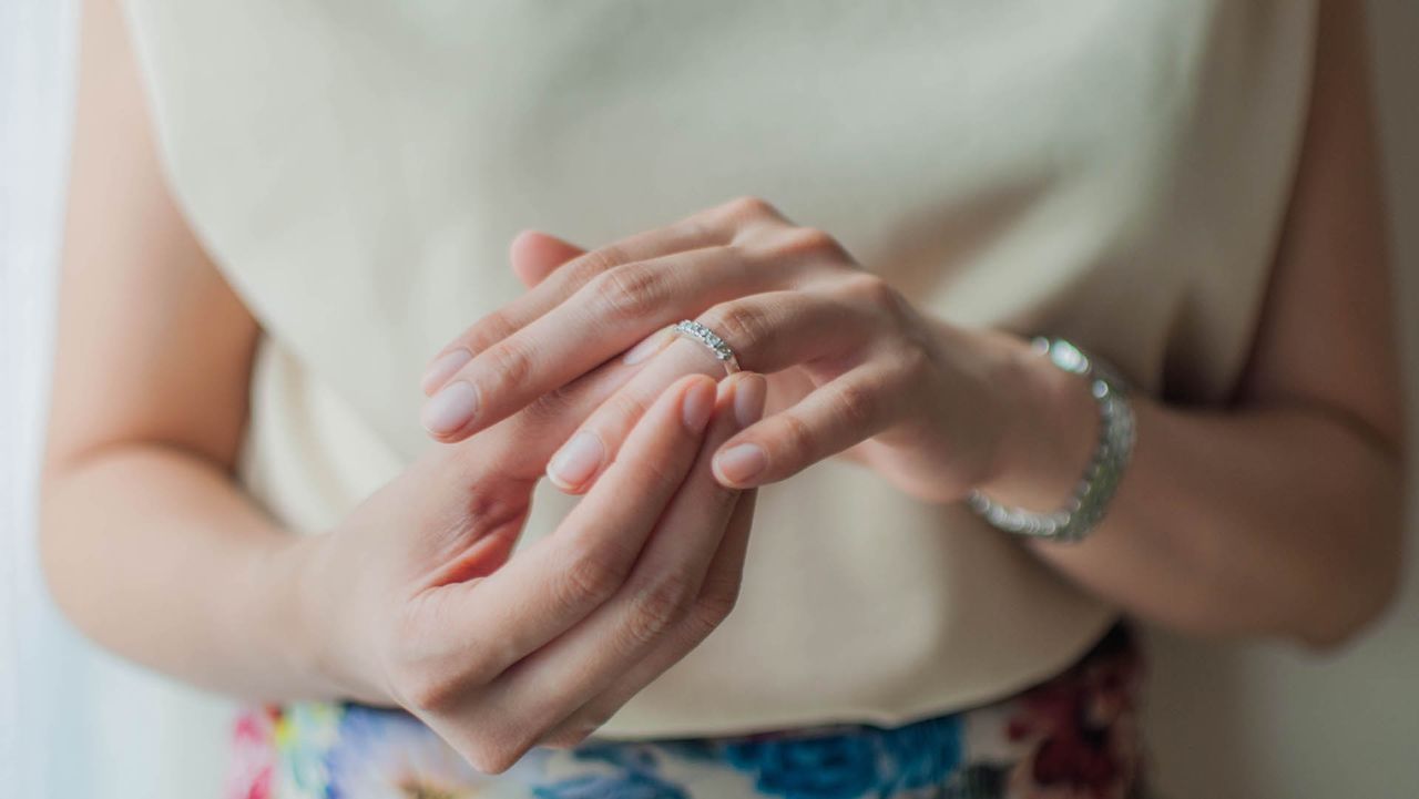 A close-up view of a young woman wearing her wedding ring