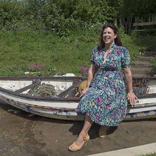 greenery with stairs and lady on boat