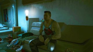 Barry sat on his sofa during the Happy Together quest in Cyberpunk 2077.